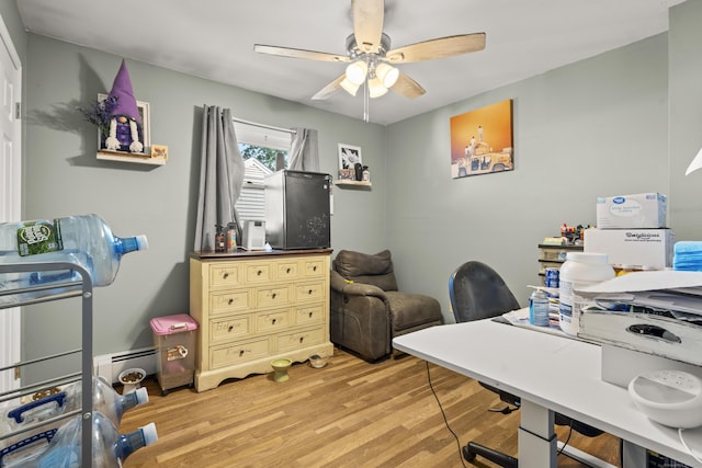 4 Warfield St, Milford, CT 06461 - home office featuring light wood-style floors, ceiling fan, and a baseboard heating unit