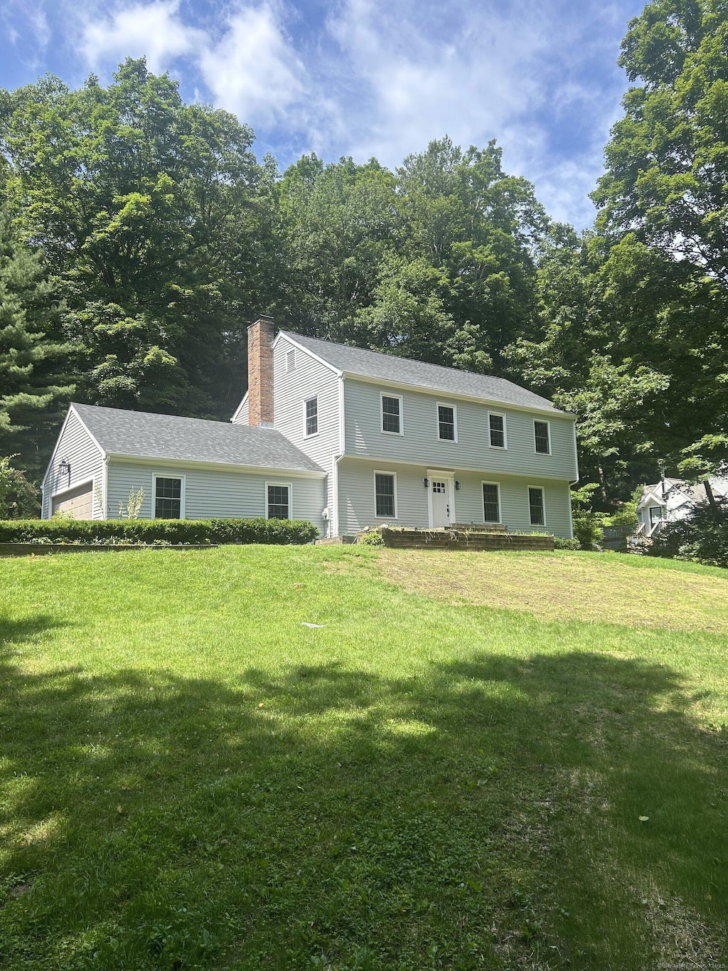 910 Goose Ln, Guilford, CT 06437 - colonial home with a chimney and a front yard