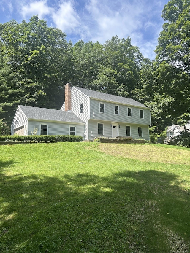 910 Goose Ln, Guilford, CT 06437 - colonial home with a chimney and a front yard