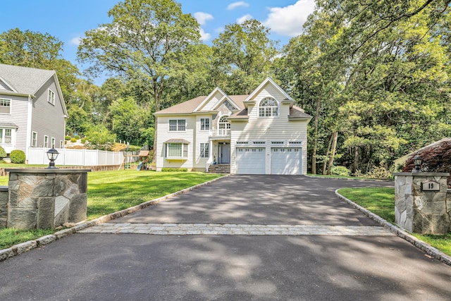 19 Woodlawn Dr, Trumbull, CT 06611 - view of front of home featuring driveway, a garage, and view of wooded area