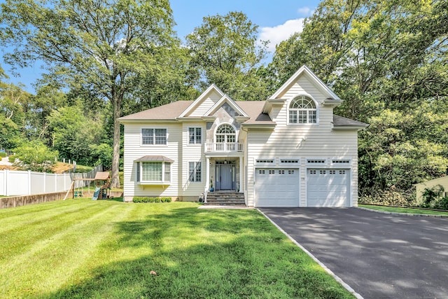 19 Woodlawn Dr, Trumbull, CT 06611 - view of front facade featuring asphalt driveway, a garage, and view of scattered trees