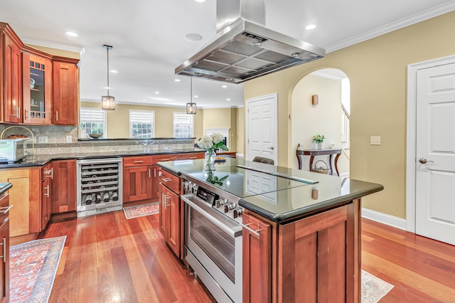 19 Woodlawn Dr, Trumbull, CT 06611 - kitchen with beverage cooler, wall chimney range hood, high end stainless steel range, wood-type flooring, and ornamental molding