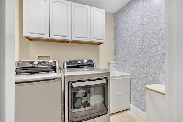 19 Woodlawn Dr, Trumbull, CT 06611 - washroom with wallpapered walls, washer and clothes dryer, cabinet space, and light tile patterned floors