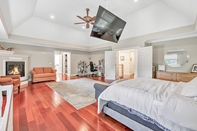 19 Woodlawn Dr, Trumbull, CT 06611 - bedroom with a tray ceiling, wood finished floors, recessed lighting, a glass covered fireplace, and ceiling fan