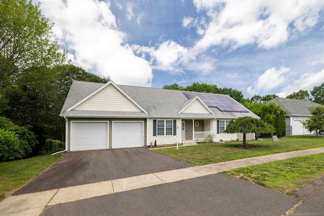 130 Bird Rd, Bristol, CT 06010 - ranch-style home featuring driveway, a garage, a front yard, solar panels, and roof with shingles