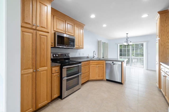 130 Bird Rd, Bristol, CT 06010 - kitchen with stainless steel appliances, a peninsula, a chandelier, recessed lighting, and hanging light fixtures