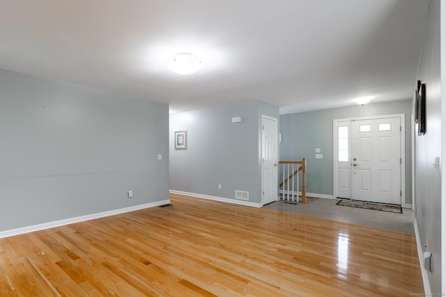 130 Bird Rd, Bristol, CT 06010 - foyer entrance with light wood-style floors and baseboards