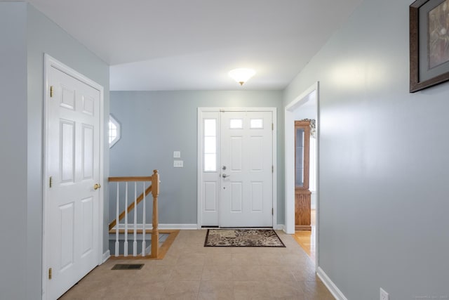 130 Bird Rd, Bristol, CT 06010 - tiled entryway with baseboards and stairs