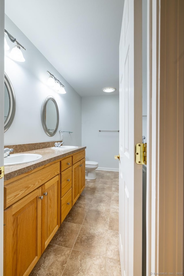 130 Bird Rd, Bristol, CT 06010 - bathroom with double vanity and toilet