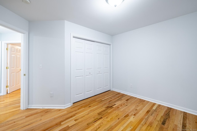 130 Bird Rd, Bristol, CT 06010 - unfurnished bedroom with light wood-style flooring and a closet