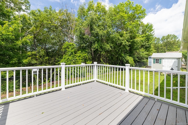 130 Bird Rd, Bristol, CT 06010 - wooden deck with a lawn, a storage shed, and view of wooded area