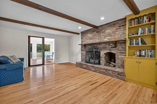 7 Sharon Ln, Old Saybrook, CT 06475 - living room with beam ceiling, light wood-style flooring, a brick fireplace, and recessed lighting