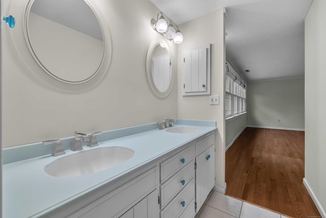 7 Sharon Ln, Old Saybrook, CT 06475 - bathroom featuring double vanity and wood finished floors