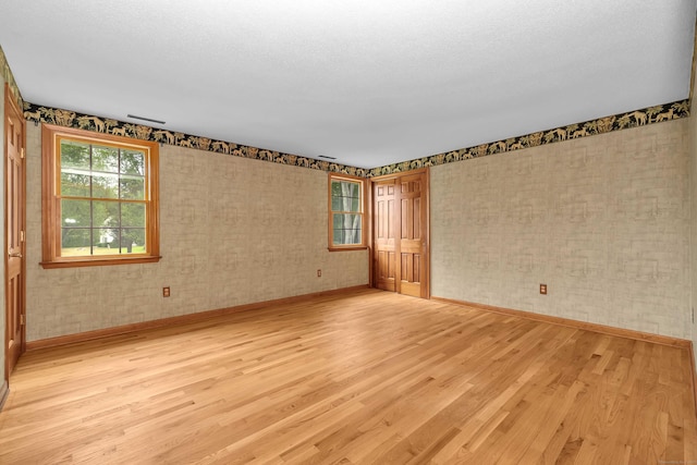 7 Sharon Ln, Old Saybrook, CT 06475 - unfurnished room with baseboards and light wood-style flooring