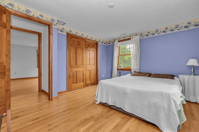 7 Sharon Ln, Old Saybrook, CT 06475 - bedroom featuring a closet and light wood-type flooring