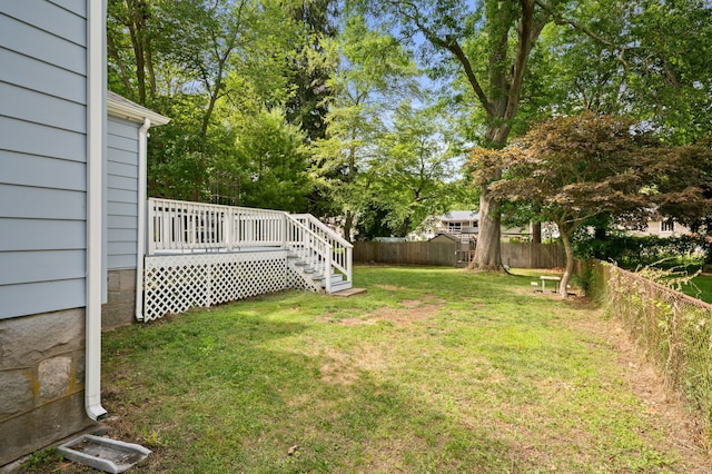 48 Godfrey St, Groton, CT 06340 - fenced backyard with a deck and view of wooded area