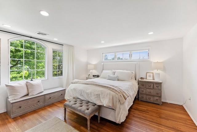 64 Red Top Dr, West Hartford, CT 06110 - bedroom with multiple windows, wood finished floors, and recessed lighting