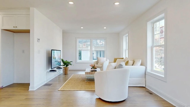 12 Woodland Dr, Milford, CT 06460 - living room with recessed lighting and light wood-type flooring