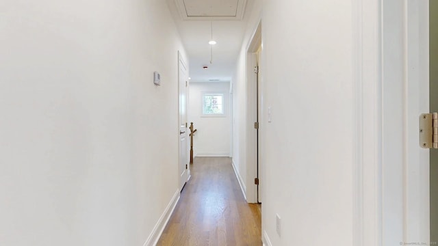 12 Woodland Dr, Milford, CT 06460 - corridor featuring attic access and wood finished floors