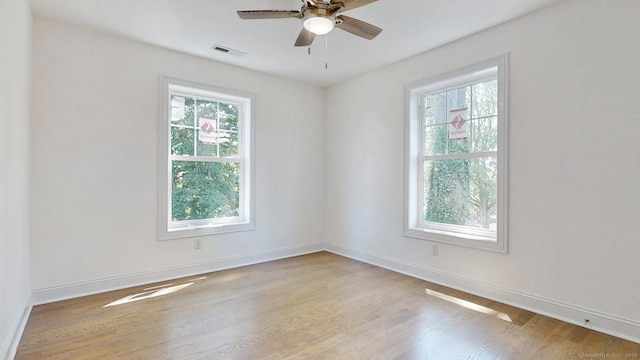 12 Woodland Dr, Milford, CT 06460 - unfurnished room featuring light wood-style flooring and ceiling fan