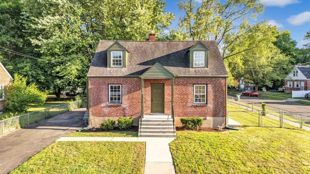 116 Morse St, Hamden, CT 06517 - new england style home featuring brick siding, a chimney, and a shingled roof