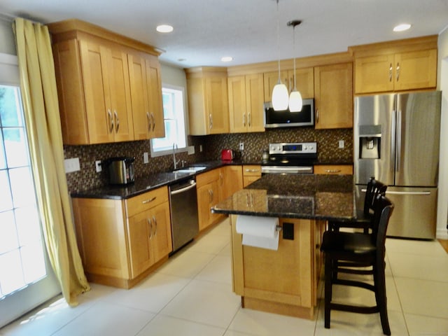 17 Ridge View Ter, New Hartford, CT 06057 - kitchen with appliances with stainless steel finishes, backsplash, a breakfast bar area, light tile patterned floors, and dark stone countertops