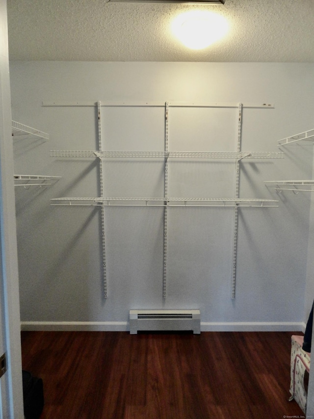 17 Ridge View Ter, New Hartford, CT 06057 - walk in closet featuring a baseboard heating unit and wood finished floors