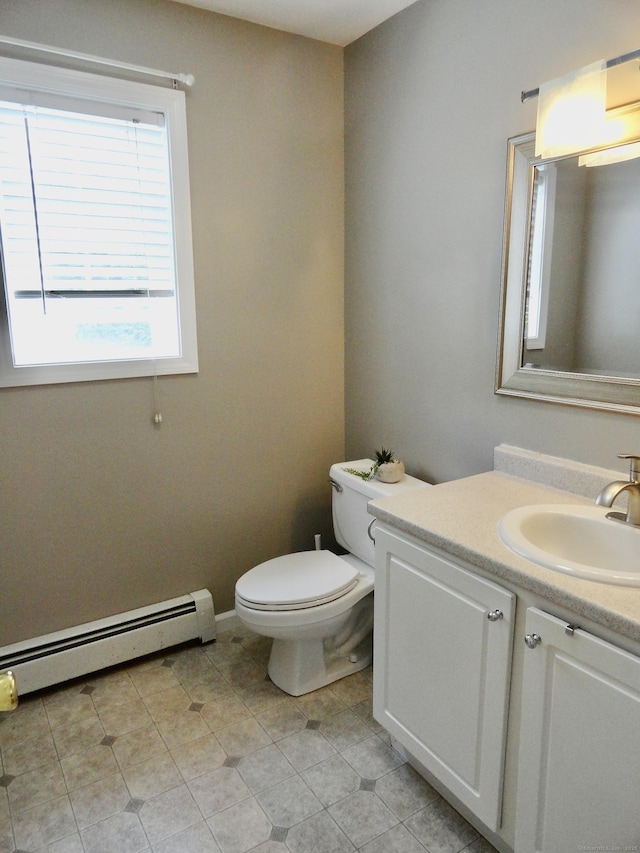 17 Ridge View Ter, New Hartford, CT 06057 - half bathroom with baseboard heating, vanity, and tile patterned floors