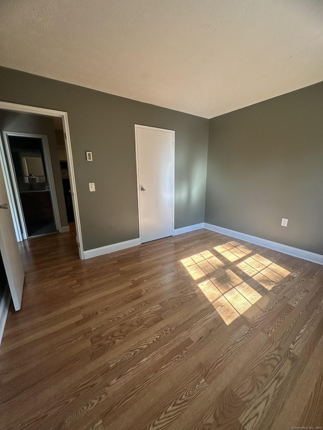 65 Horse Pond Rd Apt G, Salem, CT 06420 - empty room with dark wood-type flooring and baseboards