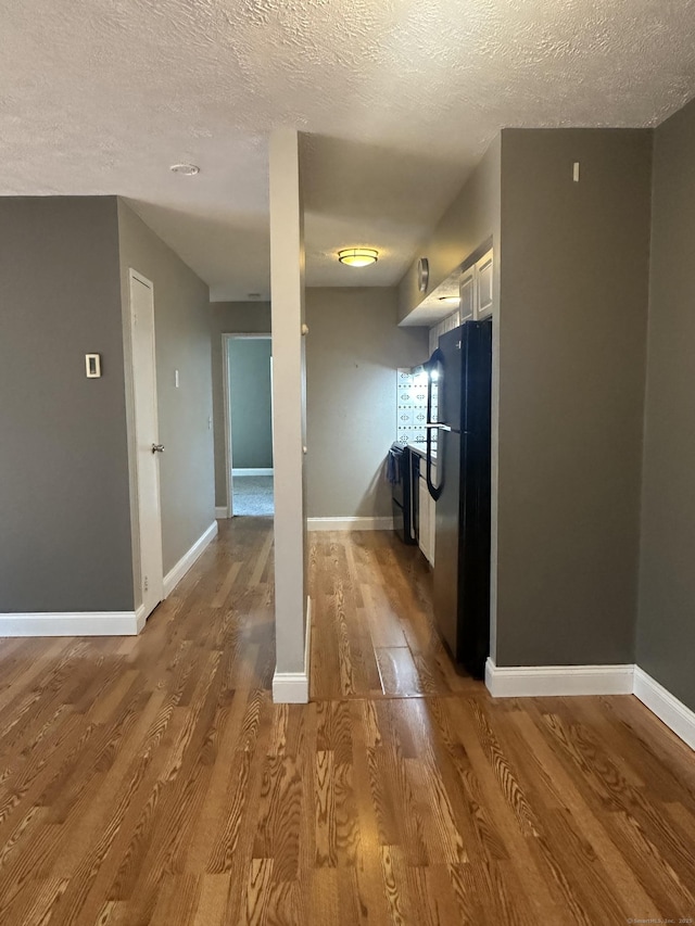 65 Horse Pond Rd Apt G, Salem, CT 06420 - empty room with a textured ceiling and wood finished floors