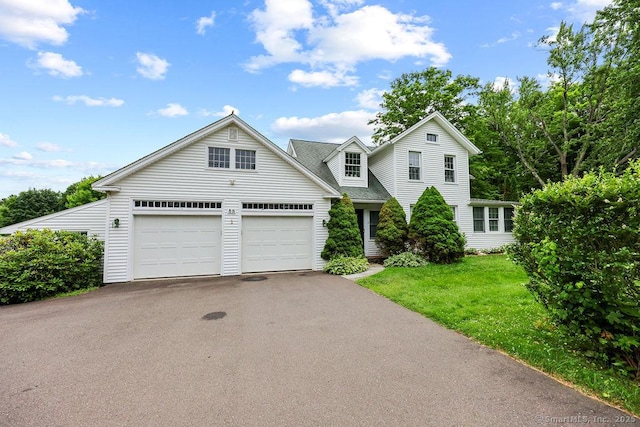 88 Powder Hill Rd, Middlefield, CT 06455 - traditional home with asphalt driveway, a front lawn, a garage, and roof with shingles