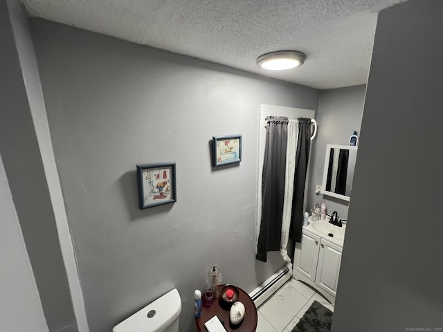 141 County St, New Haven, CT 06511 - full bathroom with a baseboard radiator, vanity, marble finish floors, a textured ceiling, and curtained shower