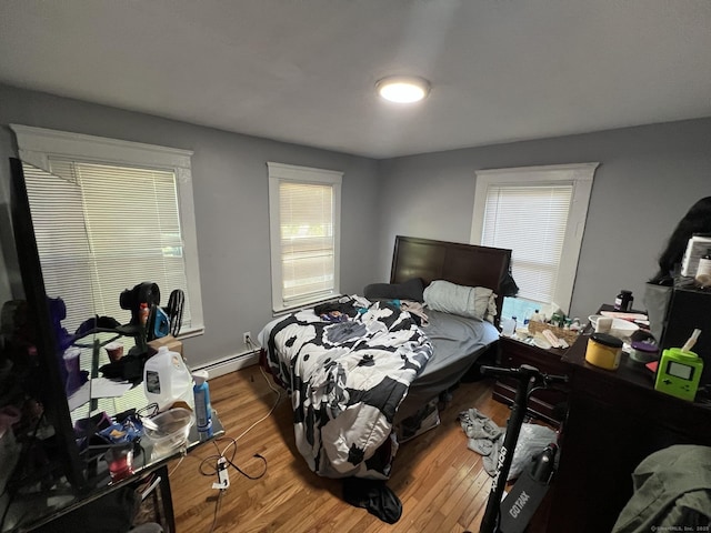 141 County St, New Haven, CT 06511 - bedroom with wood finished floors and a baseboard heating unit