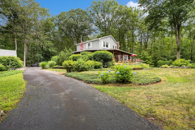 view of side of home featuring driveway