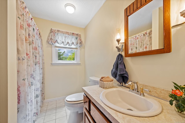 full bath featuring vanity, tile patterned flooring, a textured ceiling, and a shower with curtain