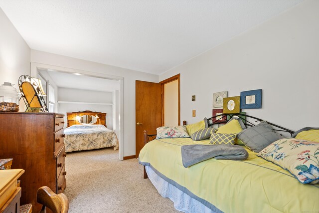 bedroom with light carpet