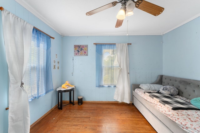 53 Columbus Ave, Bristol, CT 06010 - bedroom with crown molding, multiple windows, wood finished floors, and ceiling fan