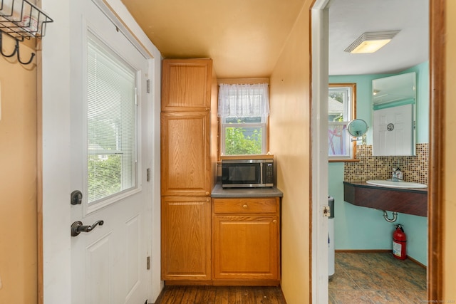 53 Columbus Ave, Bristol, CT 06010 - doorway with a sink and baseboards