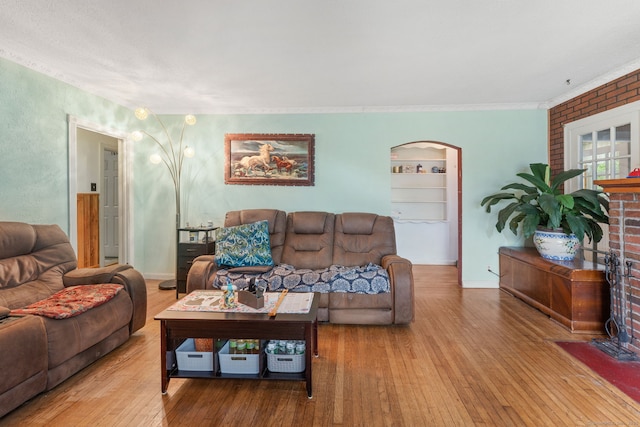 53 Columbus Ave, Bristol, CT 06010 - living area with ornamental molding, hardwood / wood-style floors, and arched walkways
