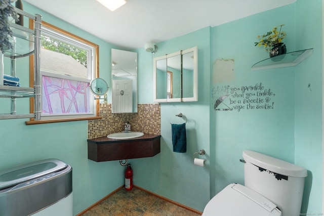 53 Columbus Ave, Bristol, CT 06010 - half bathroom with a sink and backsplash