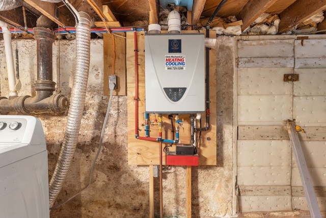 53 Columbus Ave, Bristol, CT 06010 - utility room featuring tankless water heater and washer / dryer