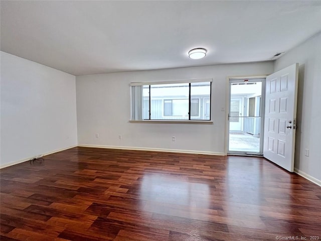 296 Main Ave Unit 1, Norwalk, CT 06851 - empty room with dark wood finished floors and baseboards