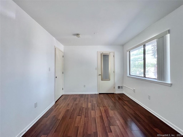 296 Main Ave Unit 1, Norwalk, CT 06851 - empty room featuring dark wood finished floors and a smoke detector