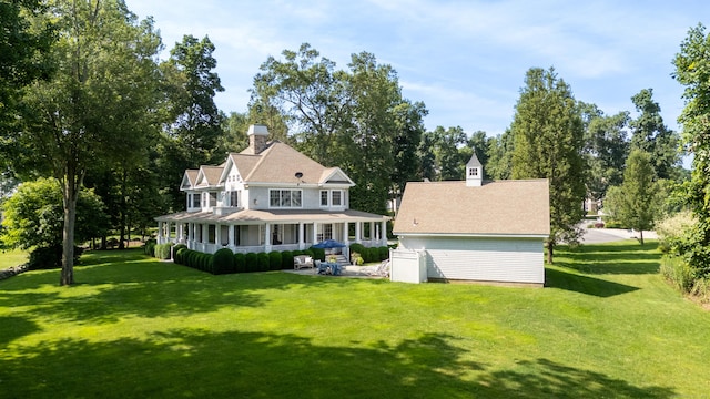 206 Fox Hopyard Rd, East Haddam, CT 06423 - rear view of house featuring a porch and a yard