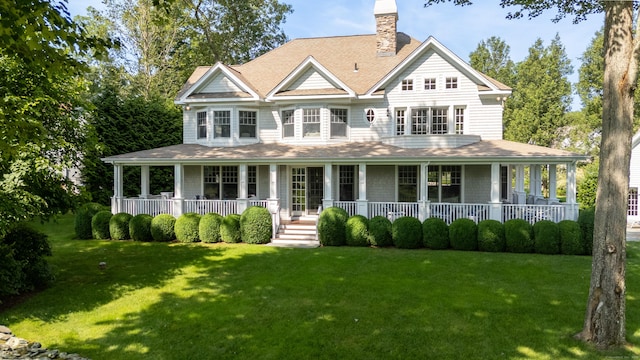 206 Fox Hopyard Rd, East Haddam, CT 06423 - view of front of house with covered porch, a front yard, a chimney, and roof with shingles