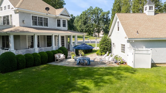 206 Fox Hopyard Rd, East Haddam, CT 06423 - view of grassy yard with a porch and a patio area