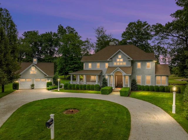 206 Fox Hopyard Rd, East Haddam, CT 06423 - view of front of house with curved driveway, a porch, a front yard, and an outbuilding