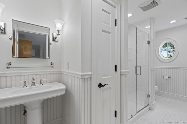 206 Fox Hopyard Rd, East Haddam, CT 06423 - full bathroom featuring wainscoting and a stall shower