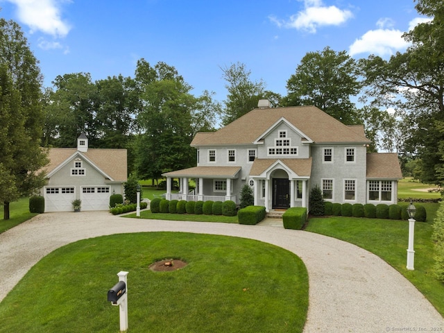 206 Fox Hopyard Rd, East Haddam, CT 06423 - view of front facade featuring curved driveway, a porch, and a front yard