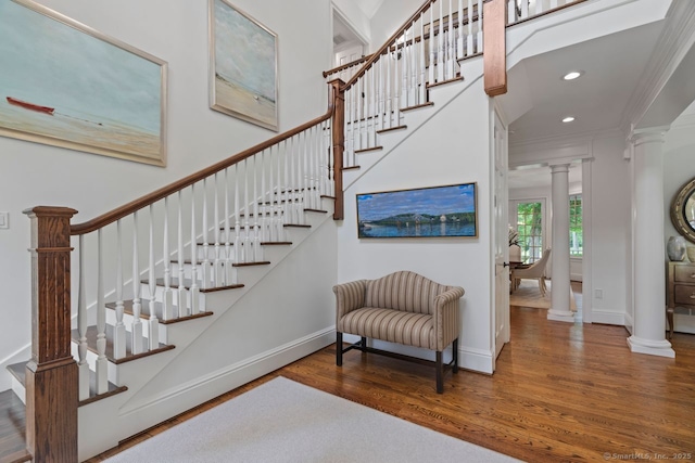 206 Fox Hopyard Rd, East Haddam, CT 06423 - stairs featuring ornate columns, wood finished floors, recessed lighting, and ornamental molding